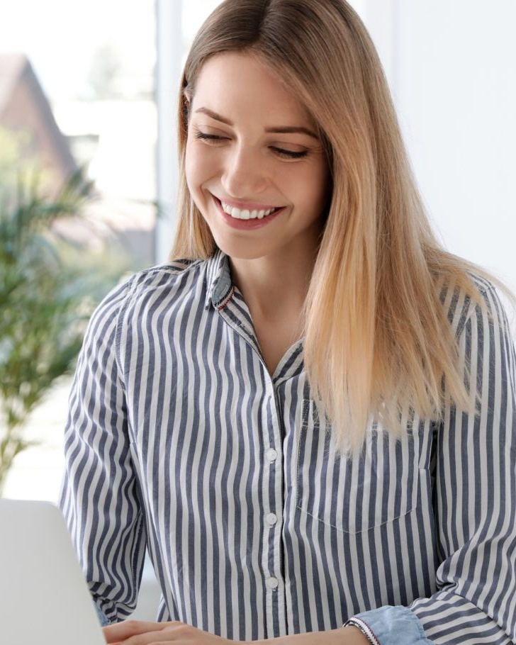 Woman makes purchase on her laptop