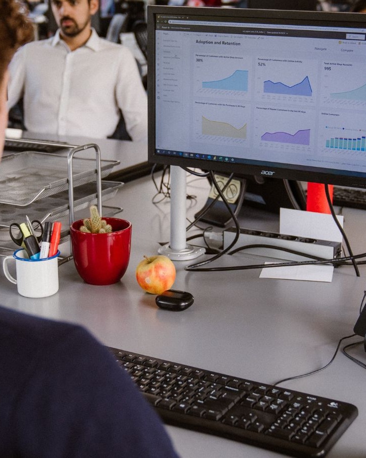 Man looks at analytics on work computer