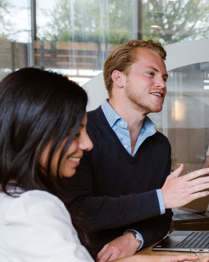 Colleagues talk in conference room