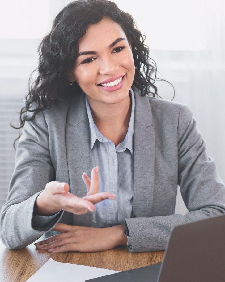 Woman presenting from her laptop