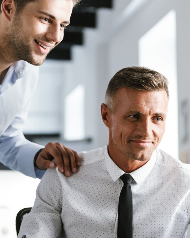 Colleagues discussing work with each other