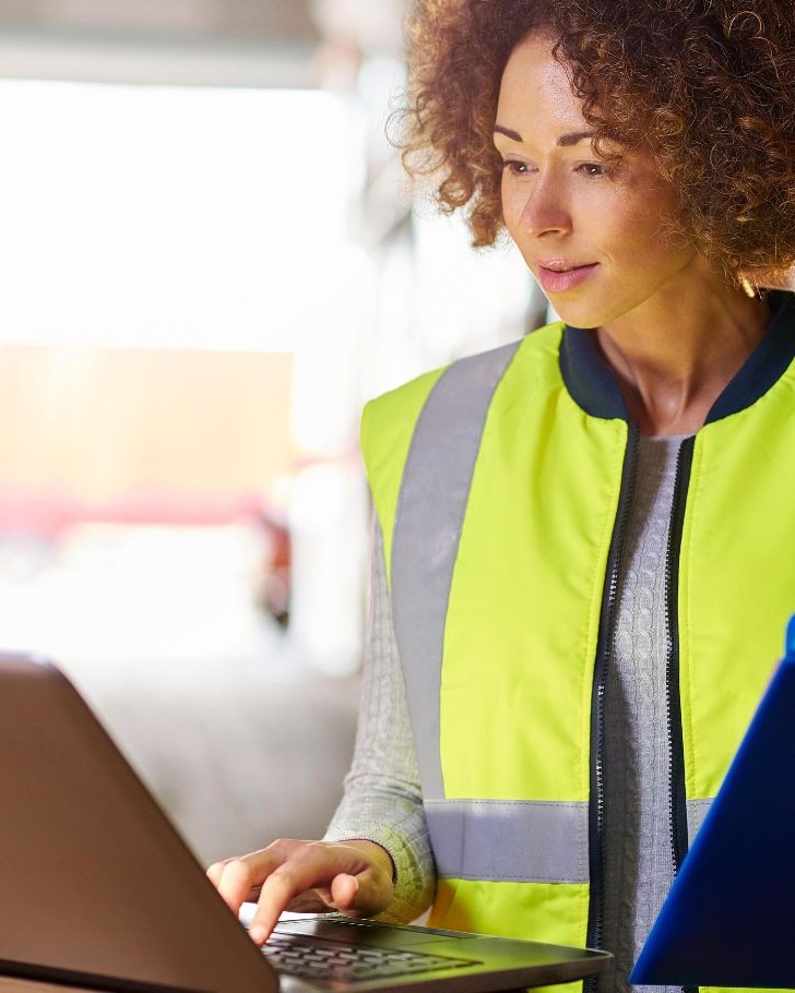 Woman works on digital commerce platform in warehouse