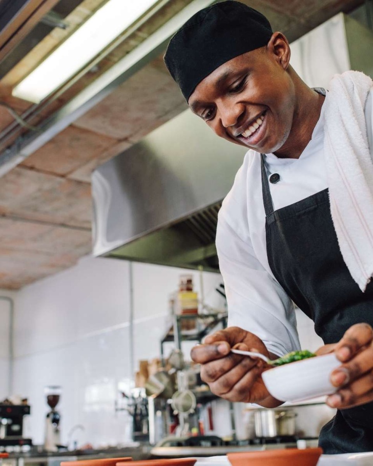 Chef-cooking-dish-in-kitchen