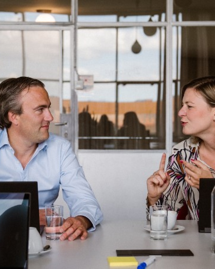 Group of professionals discussing e-commerce business - Why should B2B companies invest in e-commerce with ERP integration