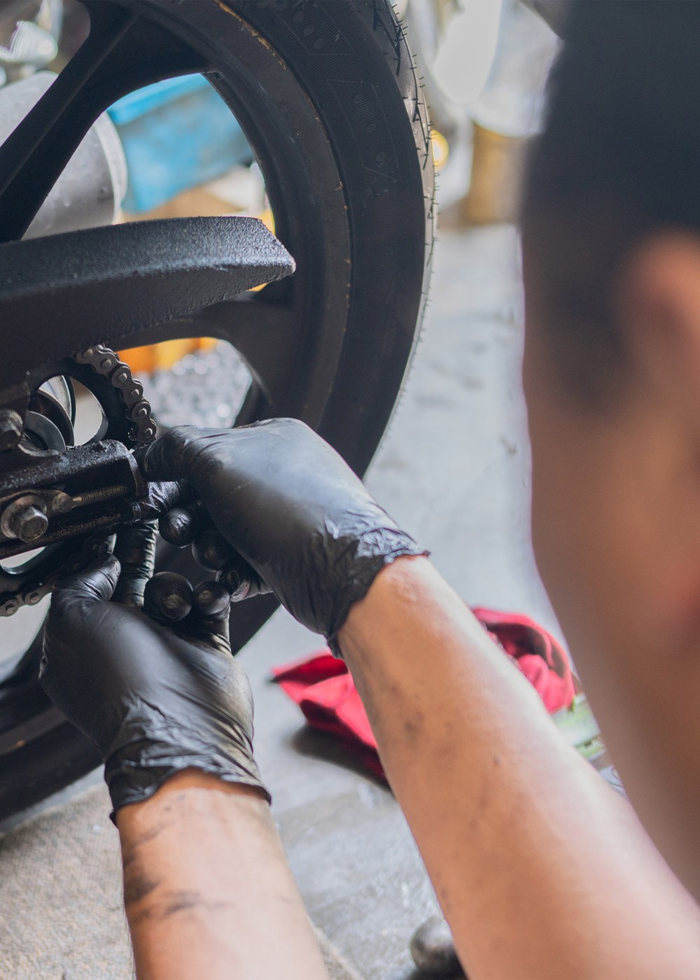 Technician at home garage replace damaged chain