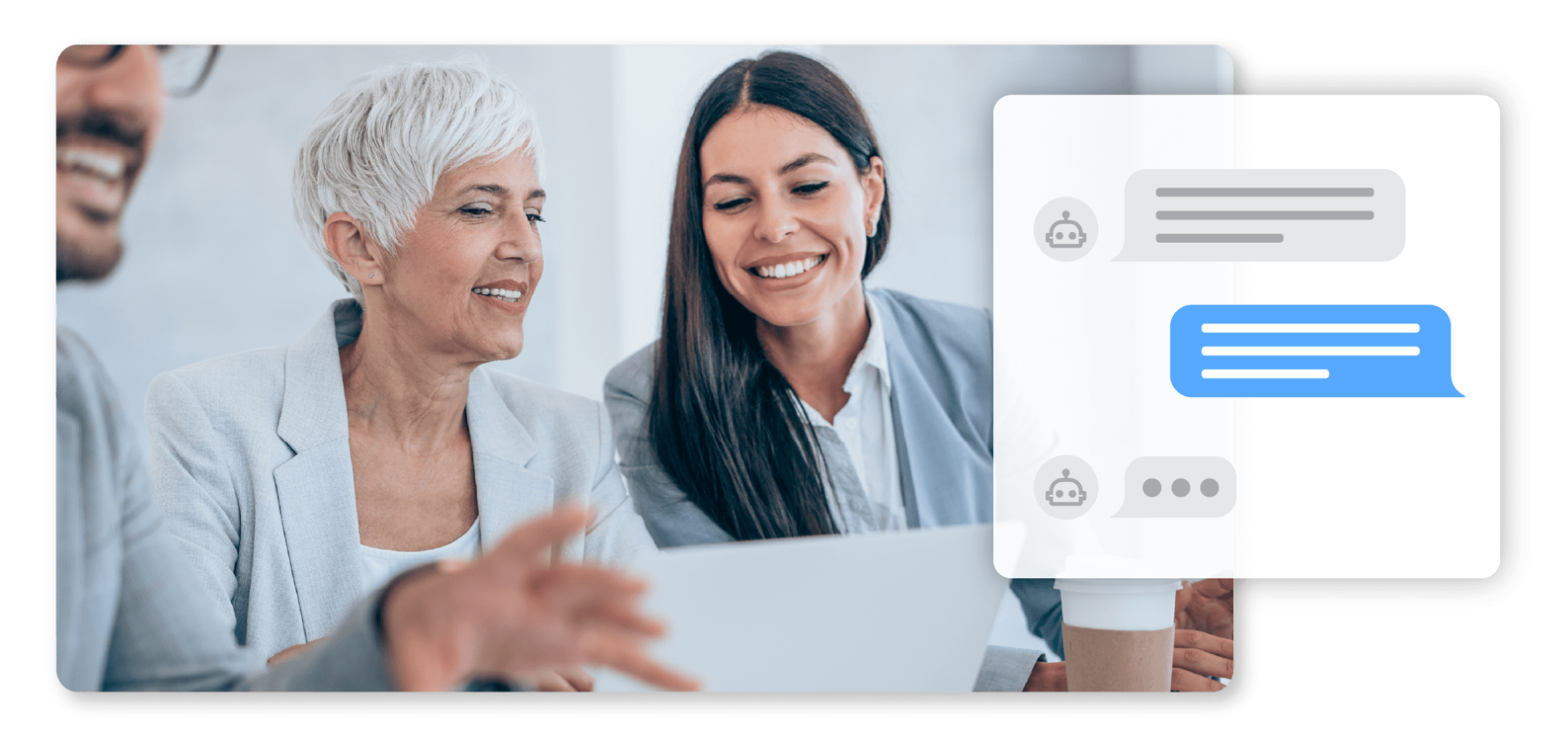 An older woman and younger woman discuss work over a laptop