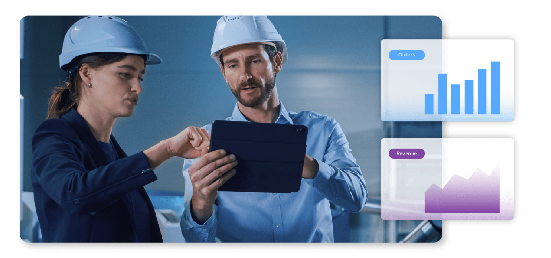 Two men in a factory work on a tablet