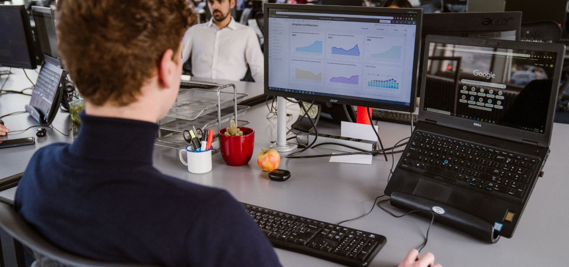 Man looks at analytics on work computer