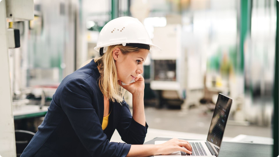 Woman in manufacturing plant working