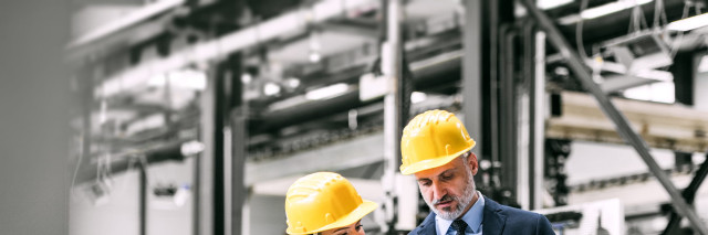 Manufacturing machinery team reading