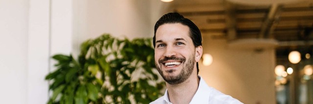 Man smiling over coffee