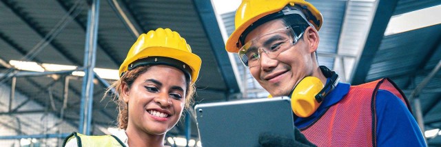 Two workers addressing supply chain issues