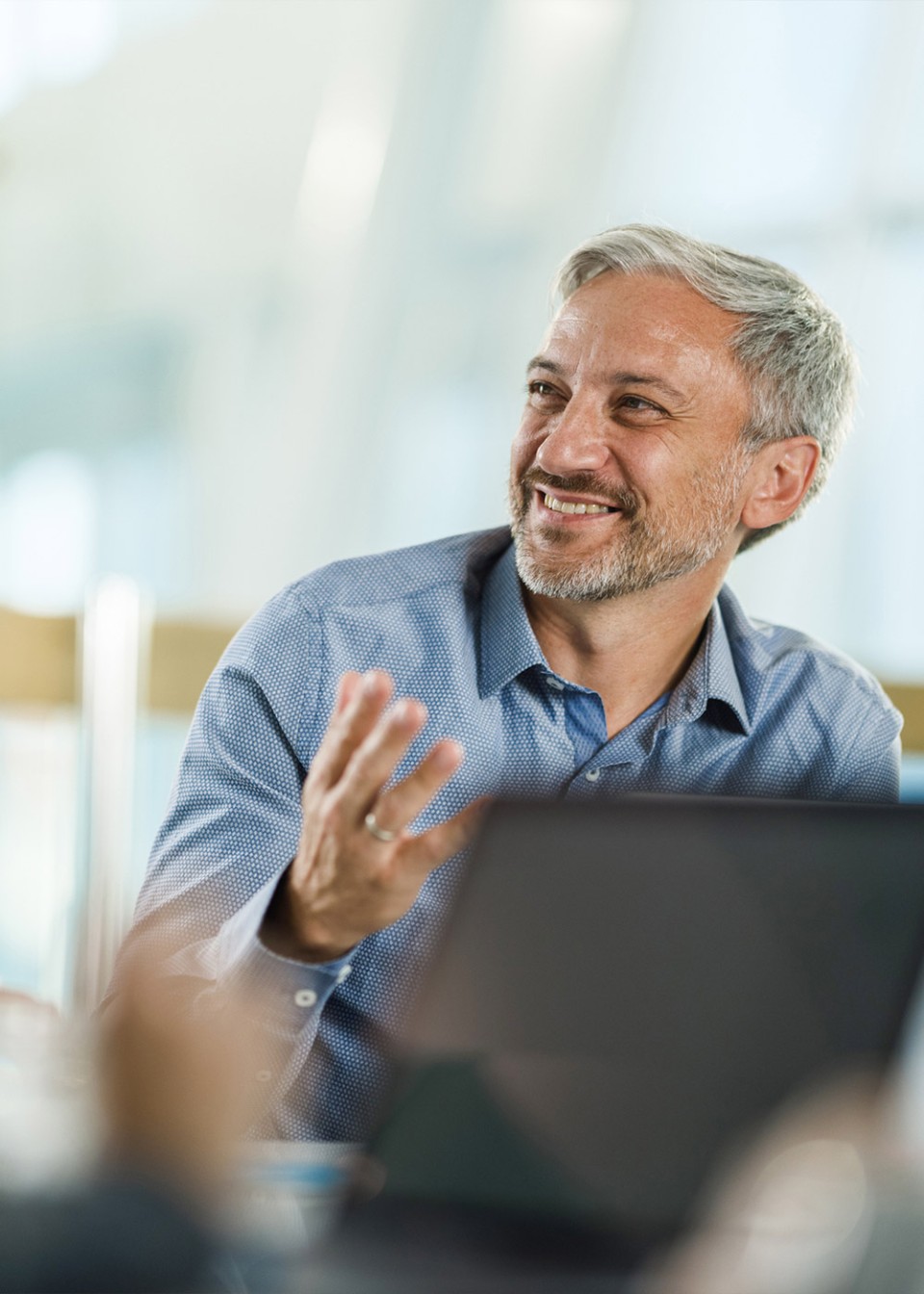 Happy male entrepreneurs talking on a meeting in the office