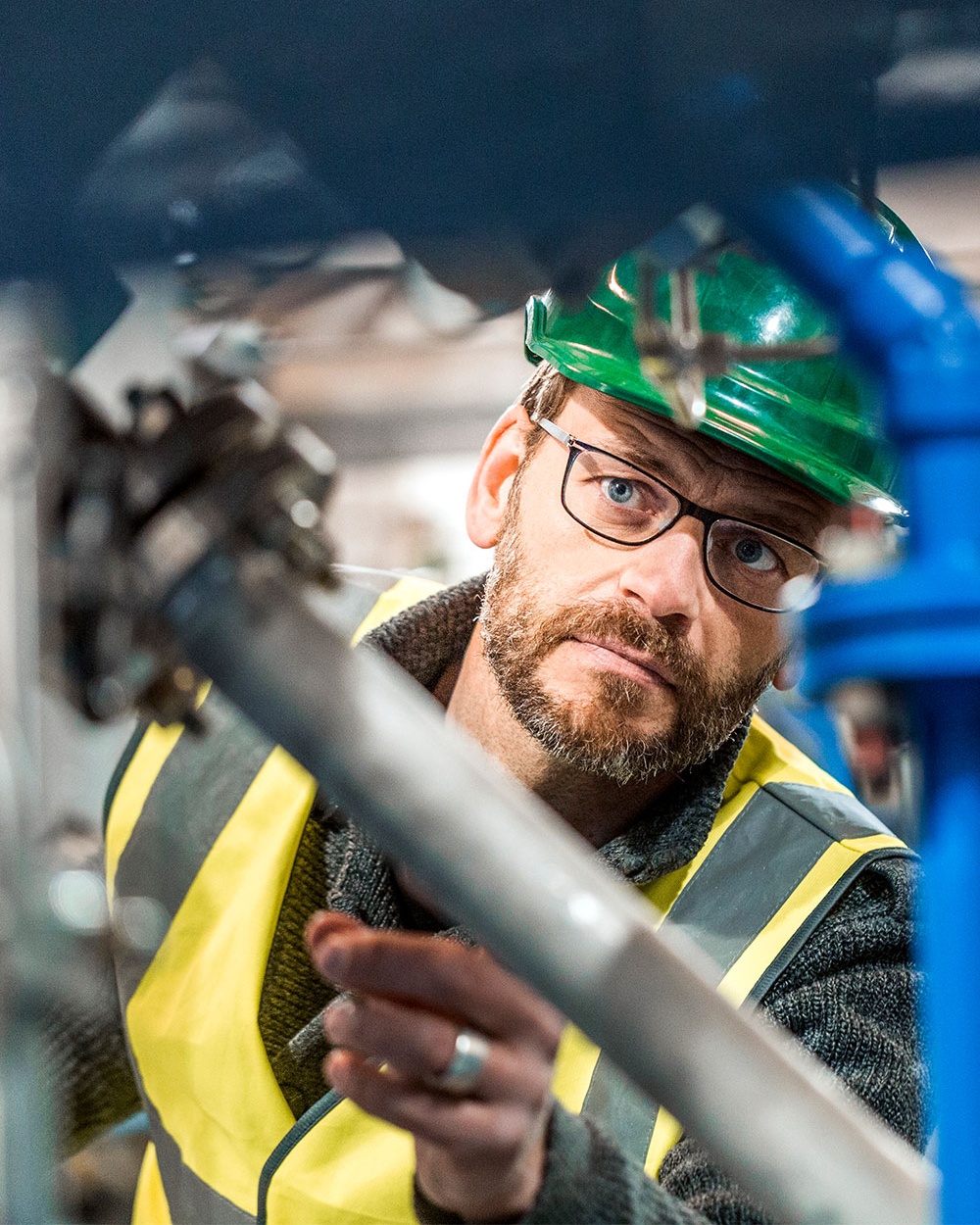 Manufacturing worker analysing machines at factory