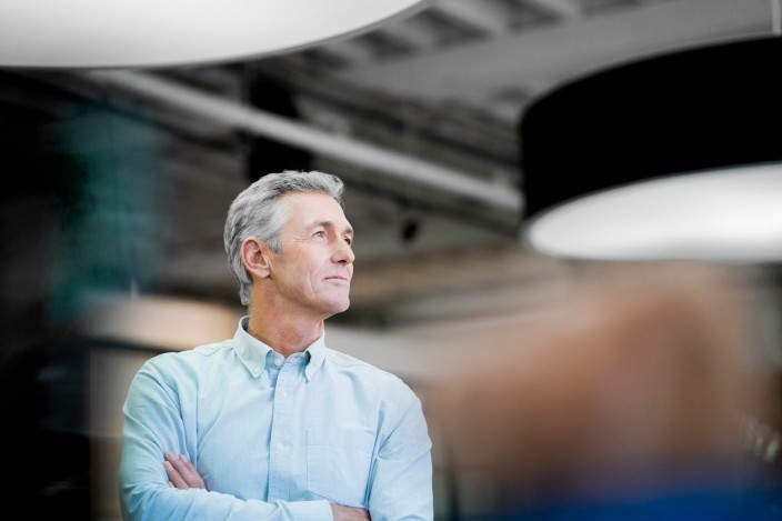 Businessman looking away at office