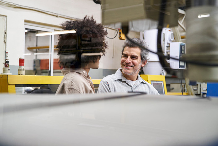 Manufacturing machinery team discussing