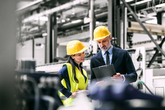 Manufacturing machinery team reading