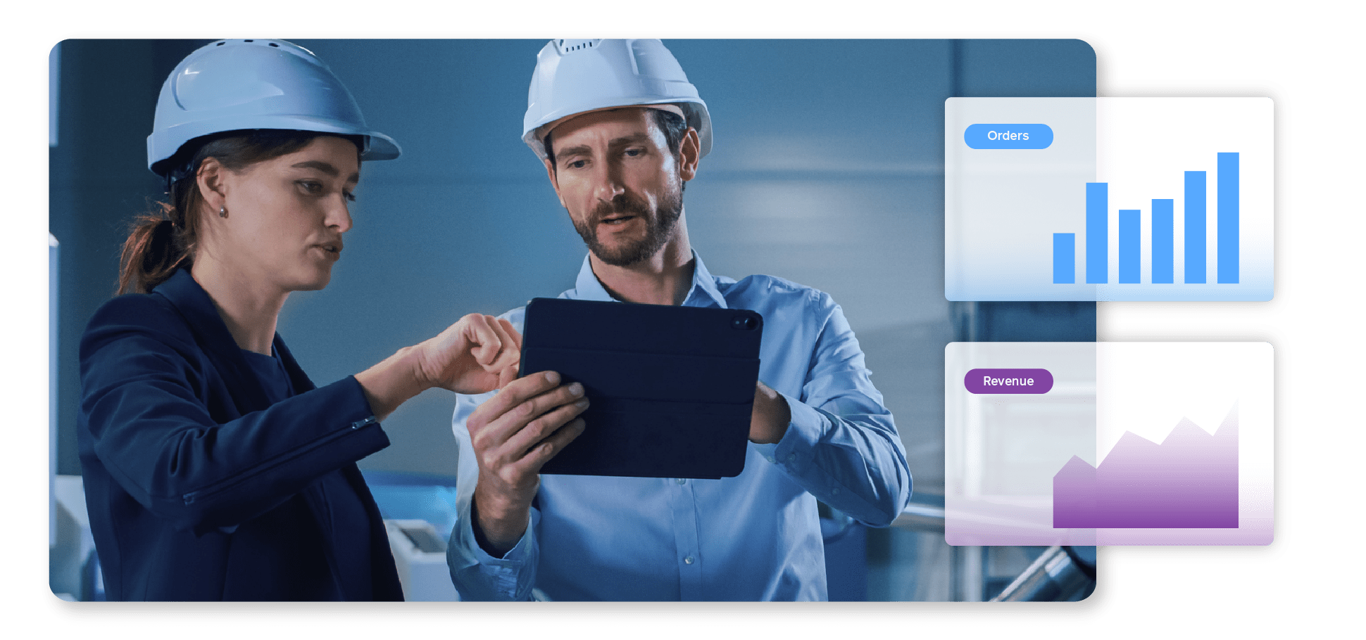 Two men in a factory work on a tablet