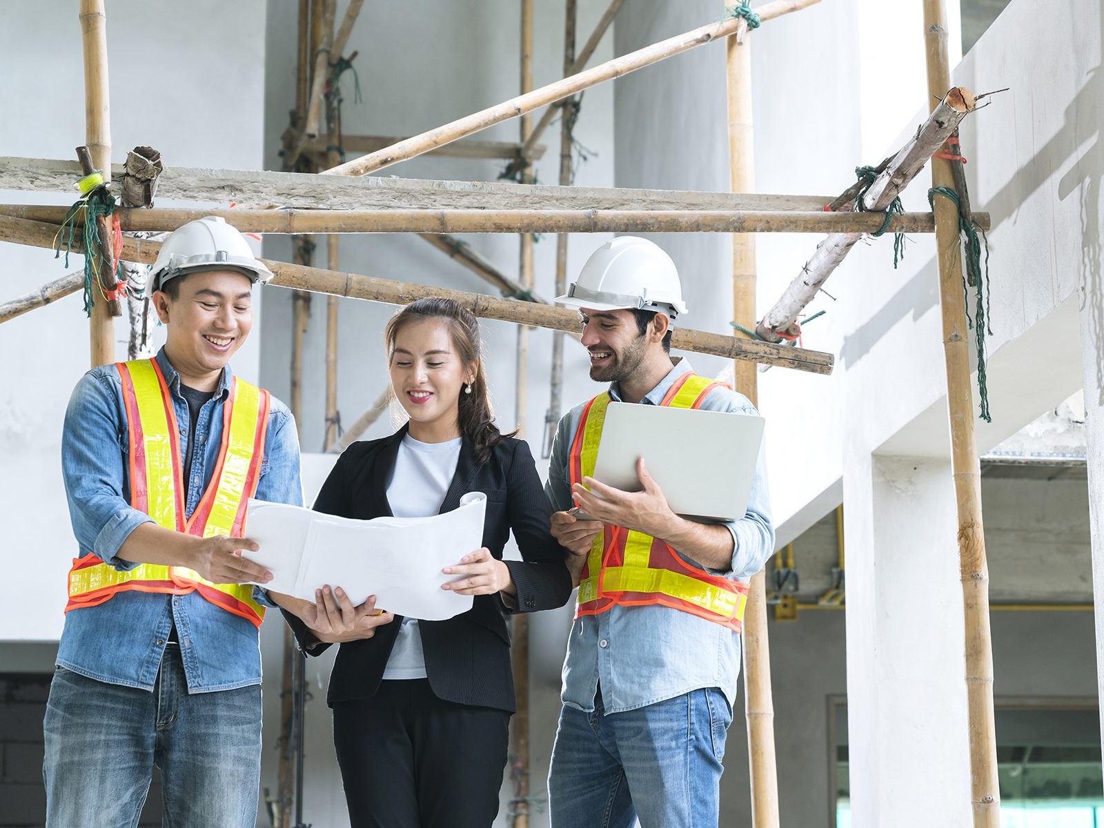 Warehouse employees examining plans