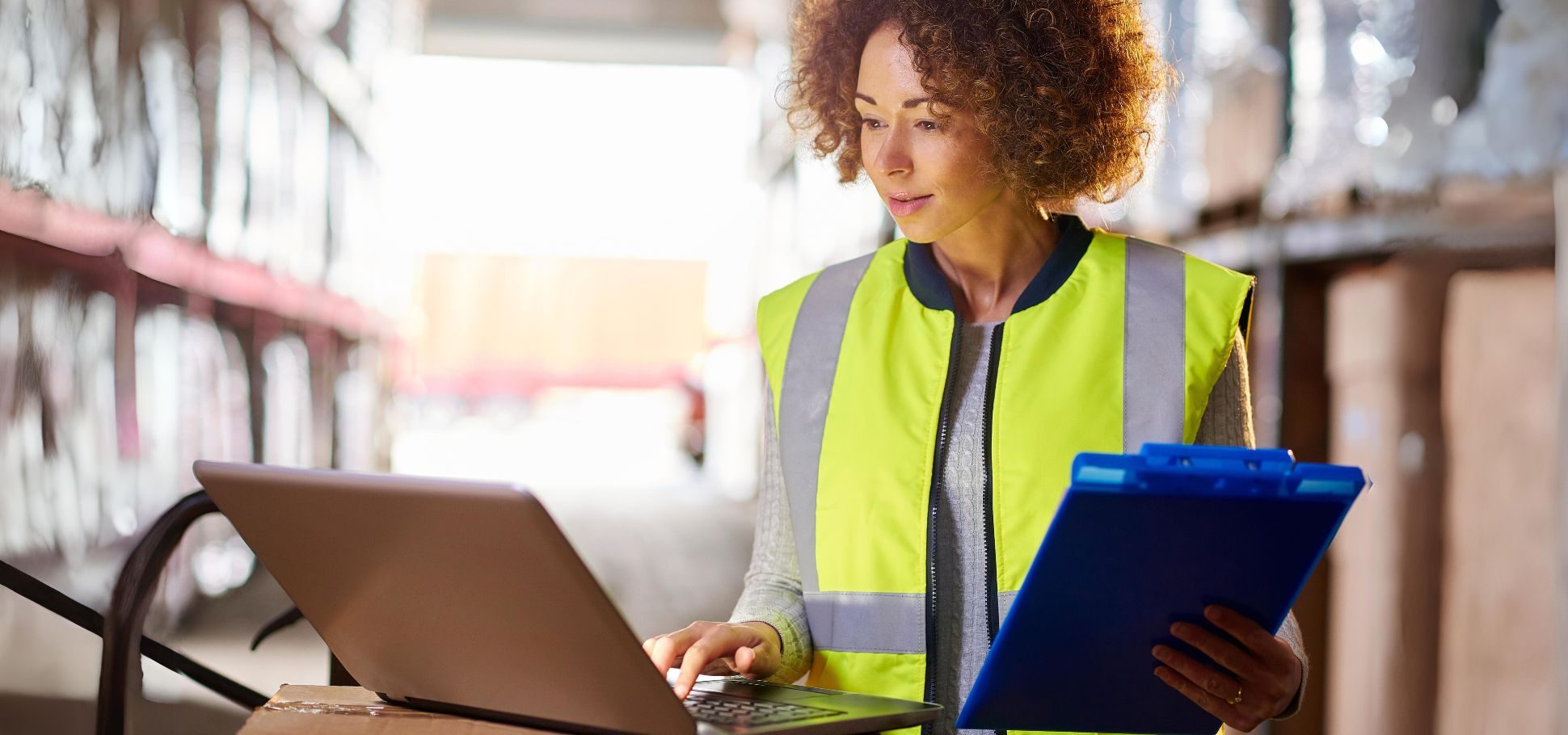 Woman works on digital commerce platform in warehouse