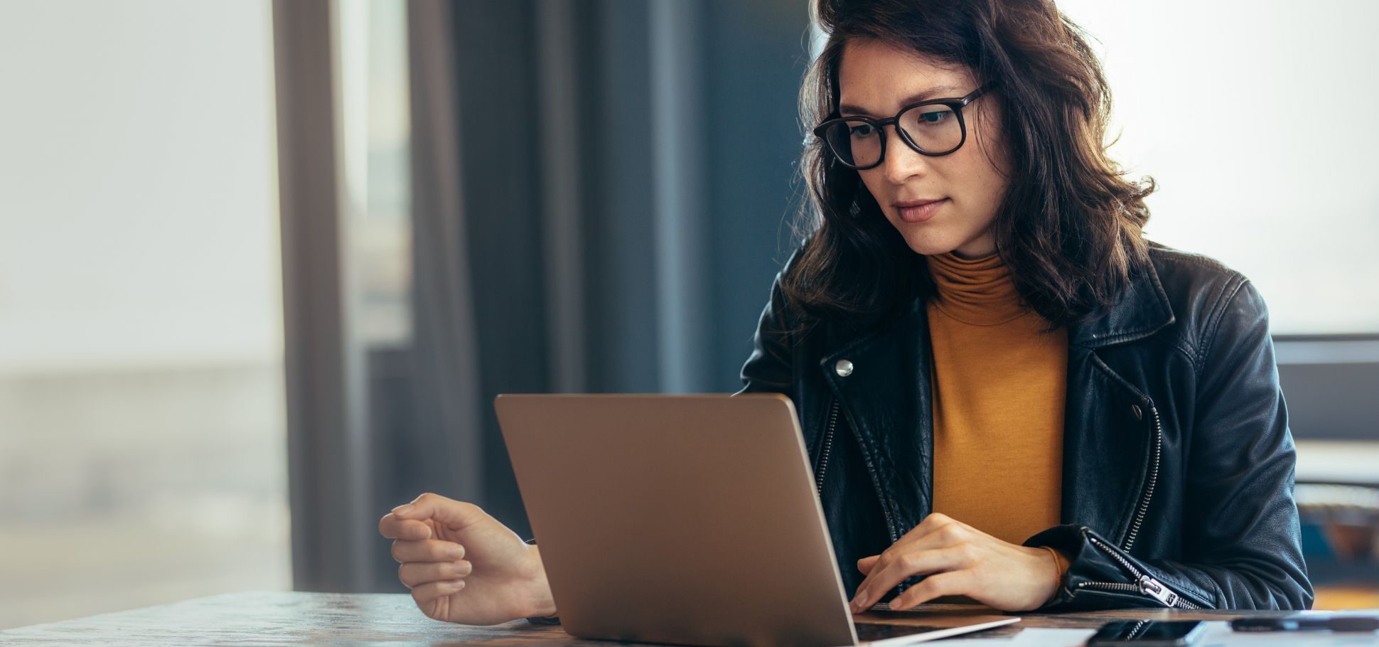 Woman works on her laptop.