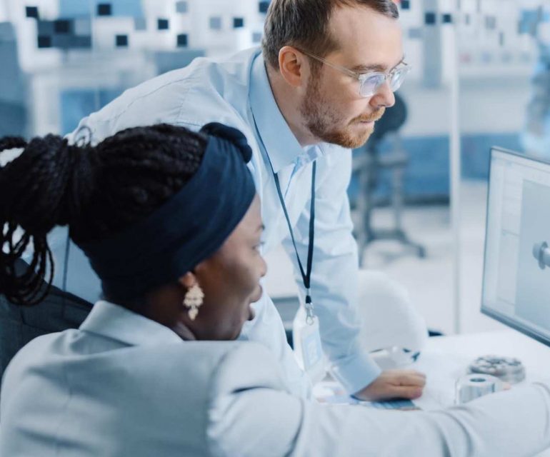 Two researchers looking at data.