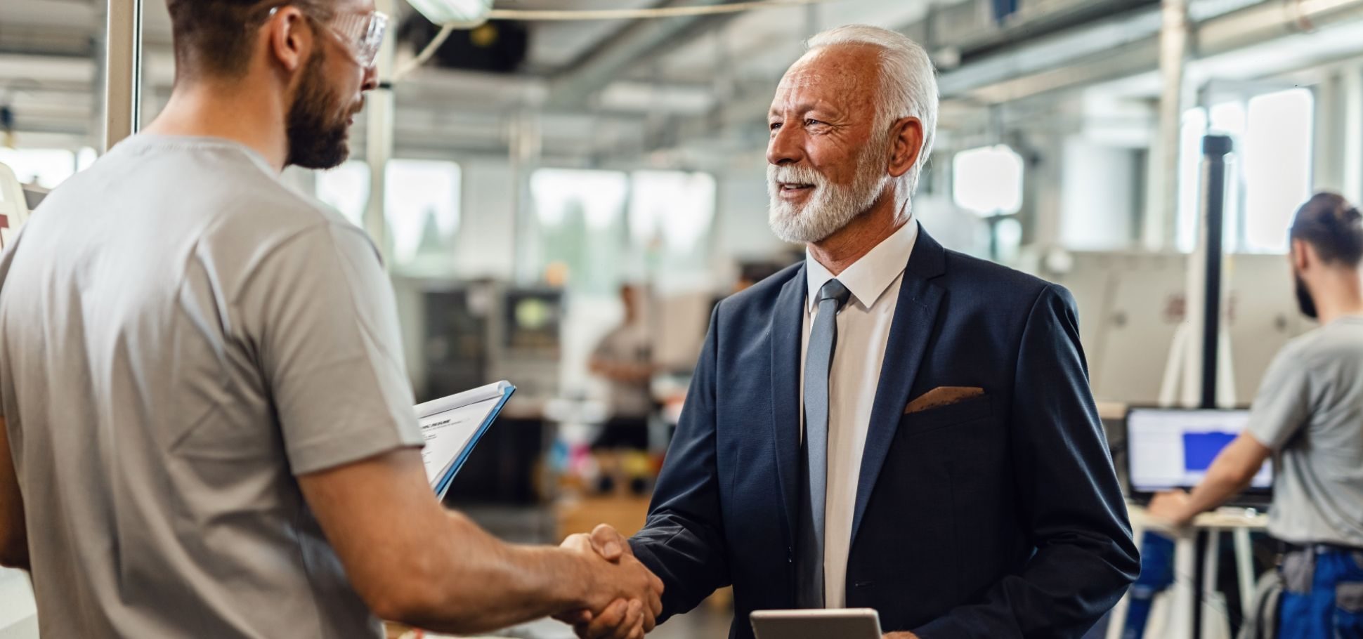 Man shaking hands with a senior colleague