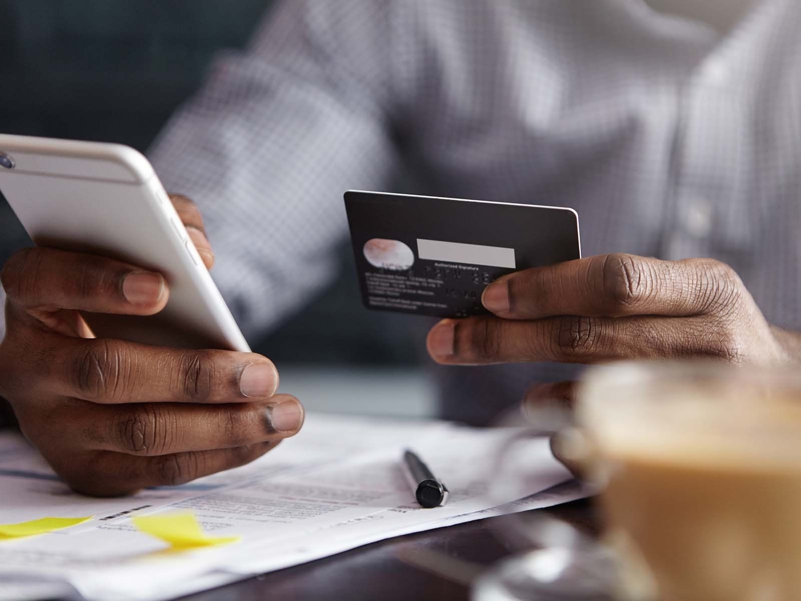 Person using credit card to shop online